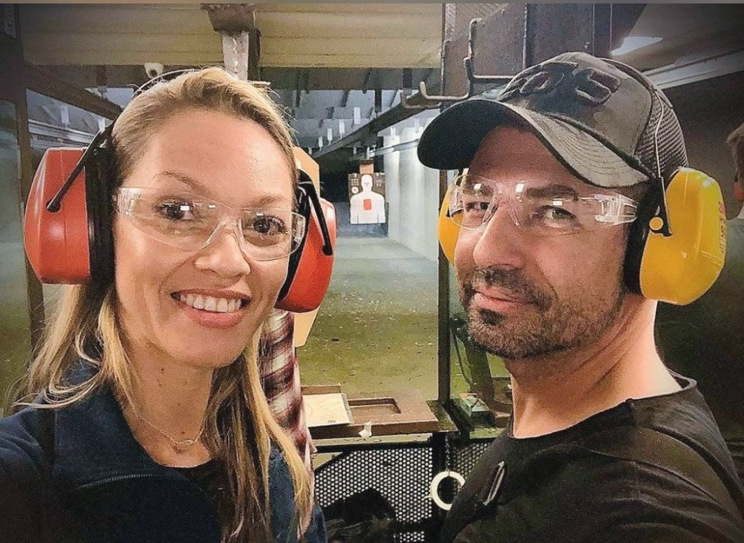 Male and female on gun range